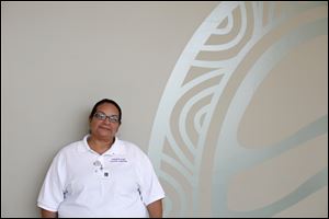 Andrea Vasquez, 51, of Toledo poses for a portrait at ProMedica Toledo Hospital on Wednesday.