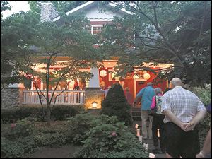 Guests arrive at the 'Bowl of Cherries' home of Sandra and Eric Gross-Whitaker during Lakeside Chataqua’s second annual home showcase to benefit the Lakeside Orchestra. 