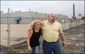 Former Autolite employees Tracy Courtney and Chris Mathias outside the old plant Friday, July 20, 2018, in Fostoria.