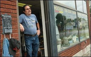 Mike Kauffman inside the Hoover repair business in Fostoria.