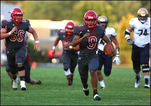 Bedford's Austin Malabanan runs in for a touchdown during a game last season. Malabanan rushed for 129 yards on 13 carries Friday in the Mules win over Pinckney.