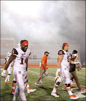 Bowling Green players walk off the field after Saturday's loss to Maryland.