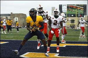 Toledo's Diontae Johnson scores the first Rockets touchdown in the first half against Miami during Saturday's game at the Glass Bowl in Toledo.