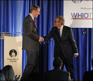 Gubernatorial candidates Richard Cordray, left, and Mike DeWine shake hands before Wednesday's debate.