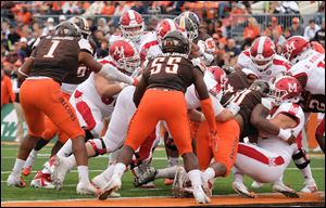 Miami quarterback Gus Ragland, bottom right, scores a touchdown against Bowling Green. The RedHawks ran for 289 yards against the Falcons on Saturday.