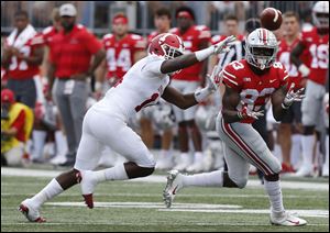 Ohio State receiver Terry McLaurin, right, catches a pass as Indiana defensive back Andre Brown defends.