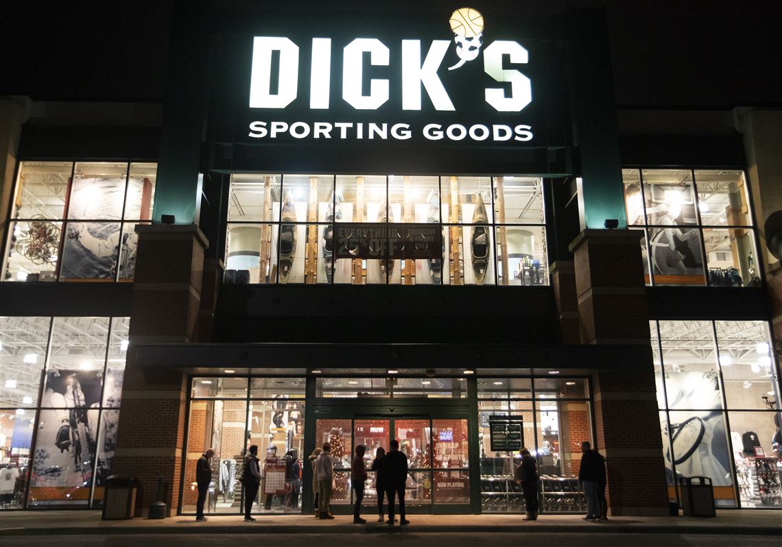 Shoppers stand outside of Dick