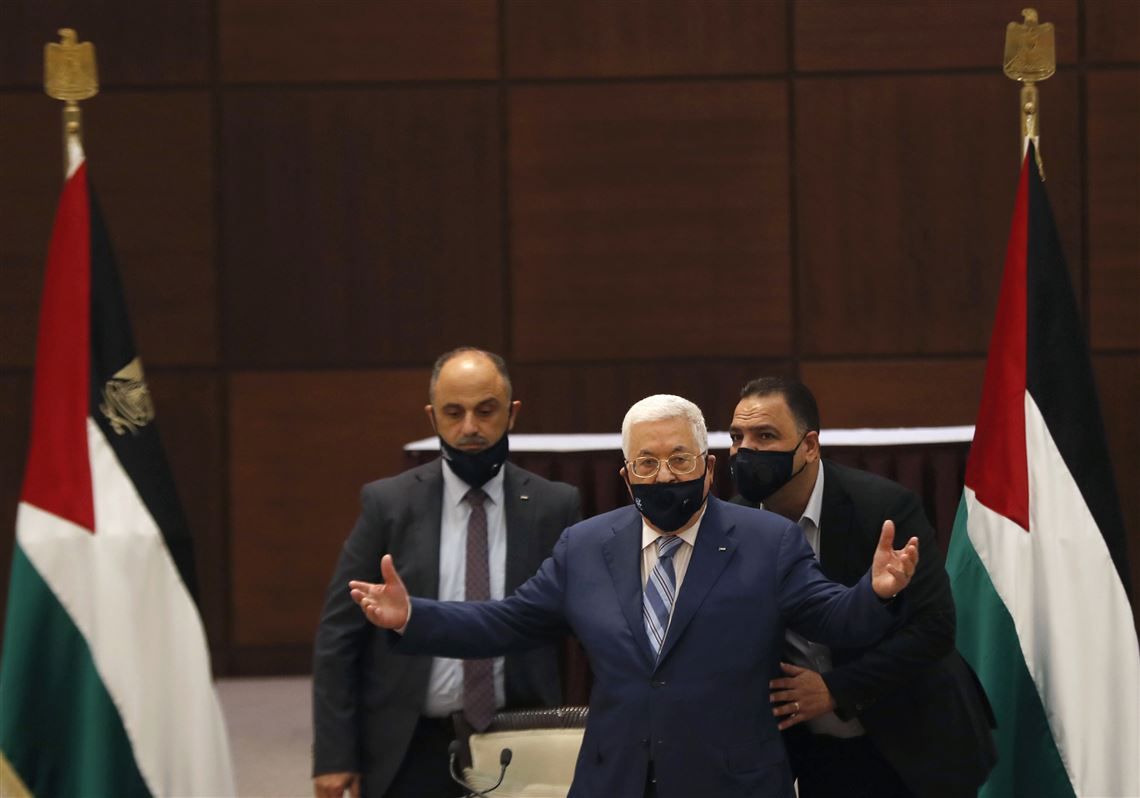 President Mahmoud Abbas gestures during a meeting with the Palestinian leadership to discuss the United Arab Emirates' deal with Israel to normalize relations, in the West Bank city of Ramallah on Tuesday, Aug. 18, 2020.