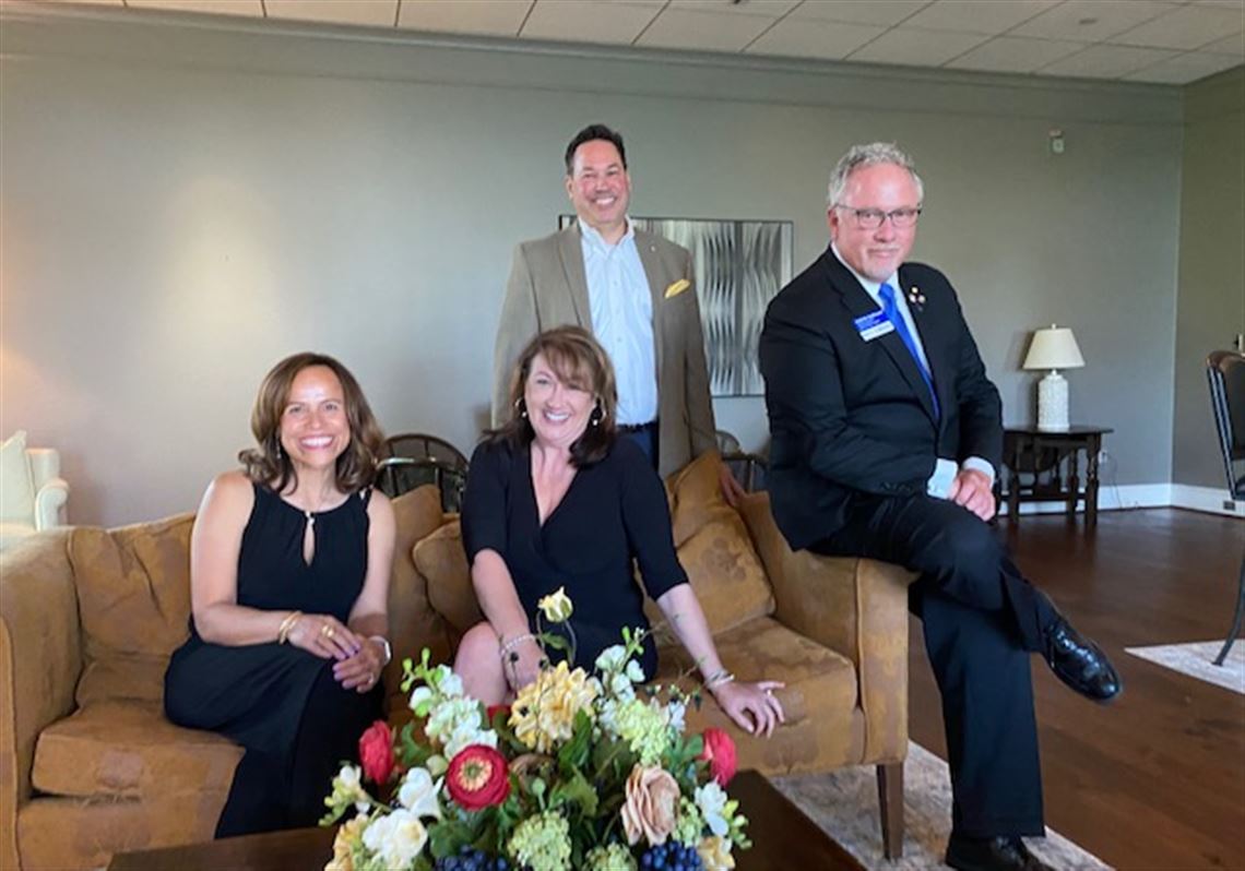 President-Elect Lorena Gloden, President Tami Wise, Immediate Past President Phil Bollin (standing), and Rotary District 6600 Governor Keith Hodkinson.