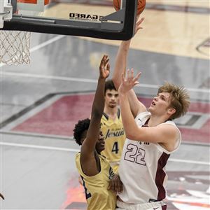 Rossford's Derek Vorst goes up for two of his 24 points in a game against St. John's Jesuit on Jan. 17 as part of the MLK Showcase.