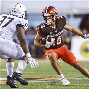 Bowling Green State University WR Austin Osborne runs the ball against Murray State defender Lawaun Powell during a college football game Sept. 18, 2021, at Doyt Perry Stadium in Bowling Green. (BLADE)