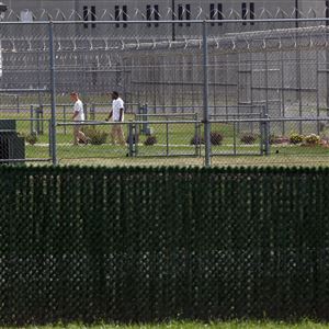 Inmates walk on the grounds of the Toledo Correctional Institution on Aug. 25, 2017.  This image is shot from Counter St. which has a residential area nearby.