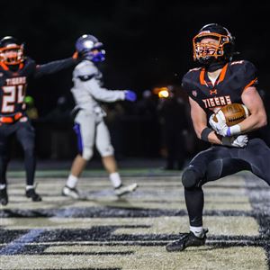 Liberty Center Tigers running back Colton Kruse celebrates a game-clinching touchdown to secure a 49-38 win in a Division V football regional final against the Elmwood Royals on Friday, Nov. 18, 2022 at Steinecker Stadium in Perrysburg.  (THE BLADE/ISAAC RITCHEY)