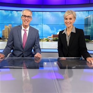 Anchors  Lee Conklin and Diane Larson pose for a photo in the studio at WTVG-TV, Channel 13, in Toledo on Nov. 15.