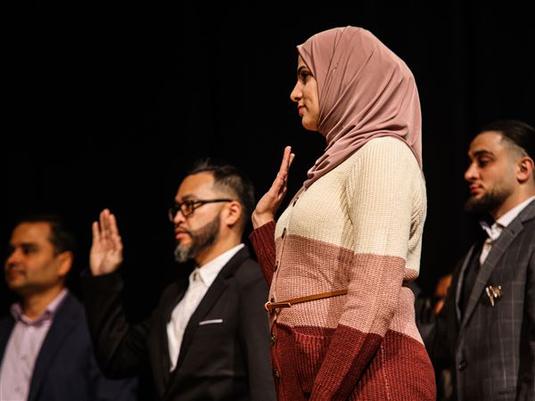 Naturalization ceremony at Whitmer High brings region 25 new U.S. citizens
