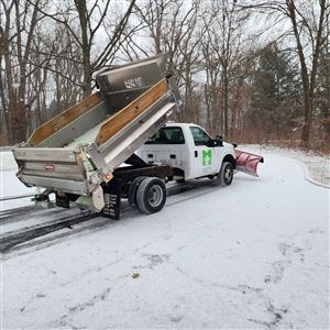 A crew clearing snow at Wildwood Preserve Metropark.