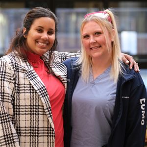 Mary Tenney, left, and Katrina Forbes get together for a photo at Mercy-St. Vincent Medical Center, Thursday, in Toledo. Tenney was revived by Forbes 47 minutes after she suffered heart failure. They attended nursing school together.