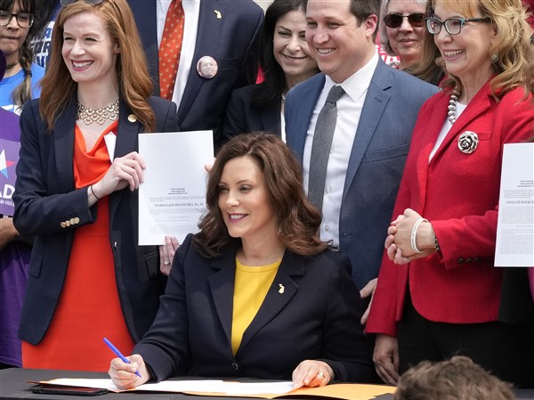 Michigan governor signs red flag gun law as questions linger over ...