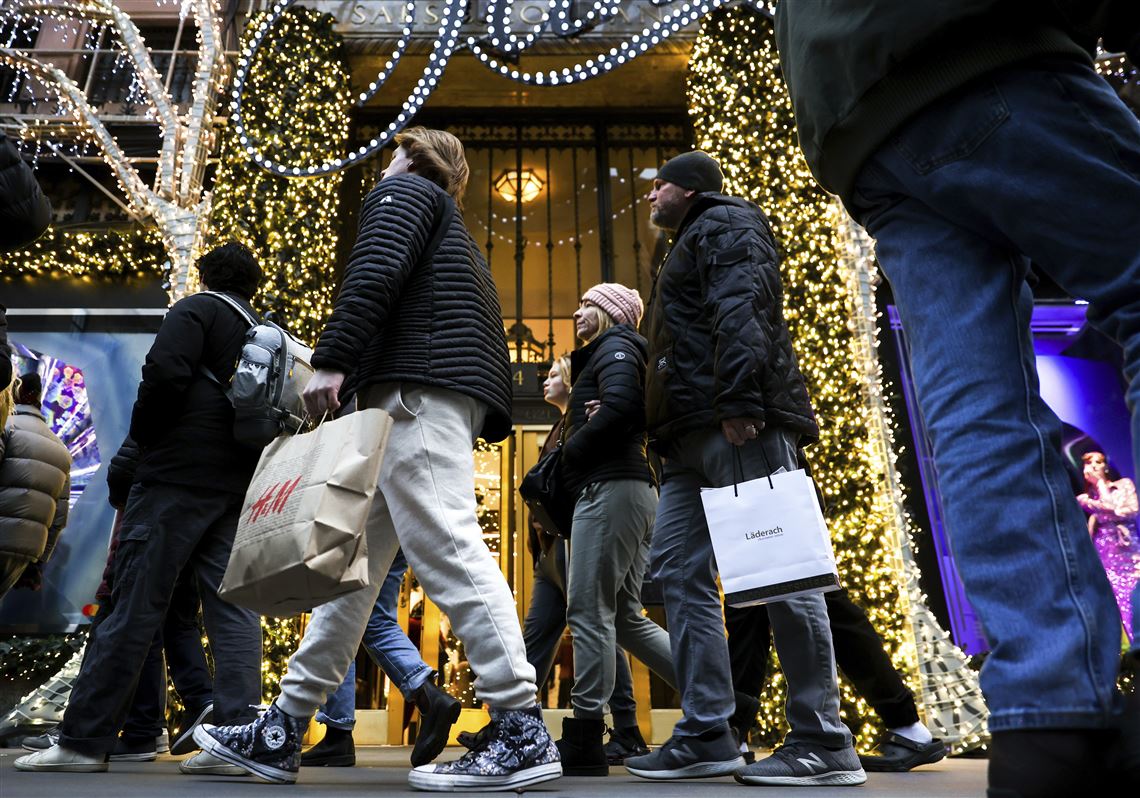 Black Friday shoppers hit stores for deals while some choose to shop online