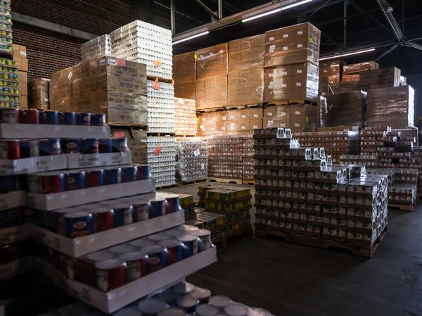 Packaged and canned food sits in a warehouse waiting to be boxed on Aug. 8, 2023 at Toledo SeaGate Food Bank in Toledo.