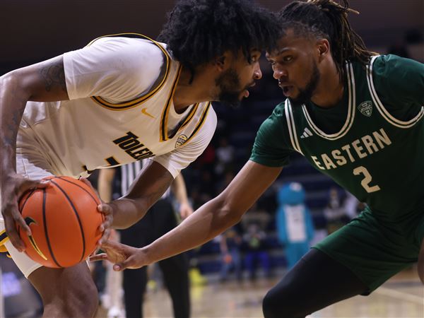 Eastern Michigan's Da'Sean Nelson corners Toledo's Isaiah Adams during the basketball game in Savage Arena on University of Toledo’s campus on Jan. 7.