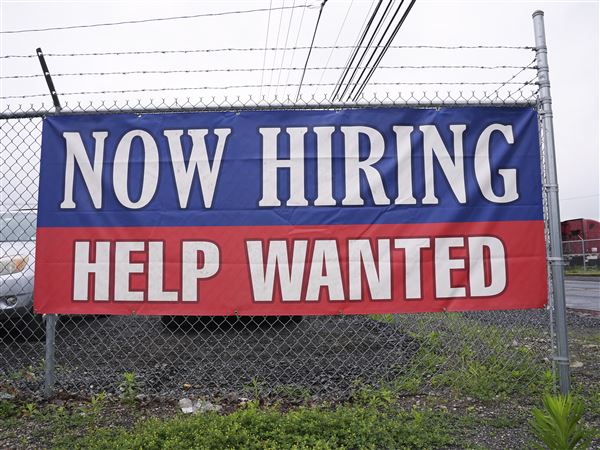 Fewer Americans file for jobless benefits last week as layoffs remain at historically healthy levels