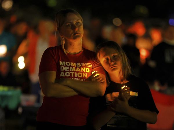 Hundreds honor 2 children killed, 17 wounded in shooting at a Minneapolis Catholic school