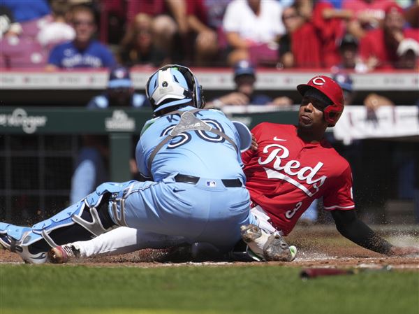 Marte z zmagovitim udarcem po sporni odločitvi prinesel zmago Reds proti Blue Jays