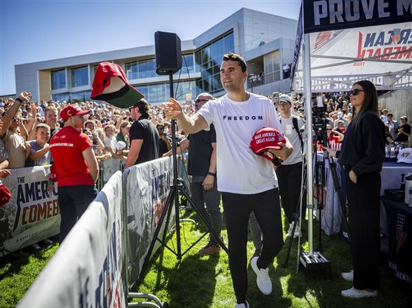 Authorities search for conservative activist Charlie Kirk's killer but provide little about motive