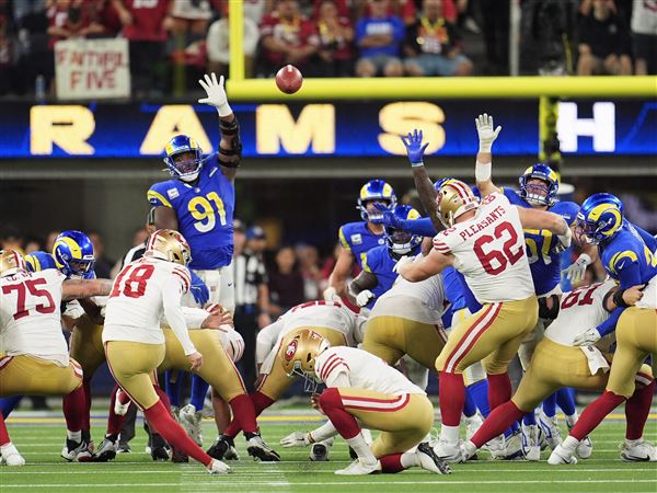 Short-handed 49ers stop Rams on downs in overtime, preserving a 26-23 victory