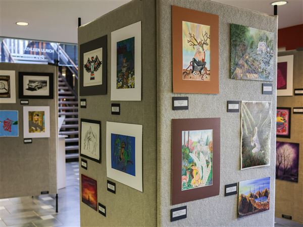 Art is displayed on Oct. 21 at Lourdes University in Sylvania. Prisoners on death row across America submit their artwork to Compassion, which offers them for sale to fund scholarships for family members of murder victims.
