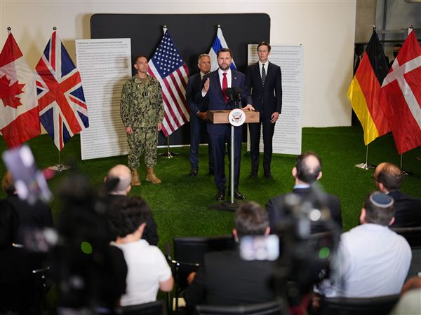 U.S. Vice President JD Vance speaks to the media as U.S. Special Envoy to the Middle East Steve Witkoff and Jared Kushner stand next to him on Oct. 21 in Kiryat Gat, Israel.