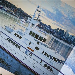 A photo of the “Ice Bear” yacht, where private chef Jonmorgan Smith most recently worked and lived, sits inside his home in Toledo on Oct. 17.