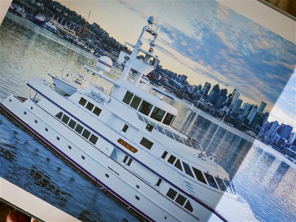 A photo of the “Ice Bear” yacht, where private chef Jonmorgan Smith most recently worked and lived, sits inside his home in Toledo on Oct. 17.