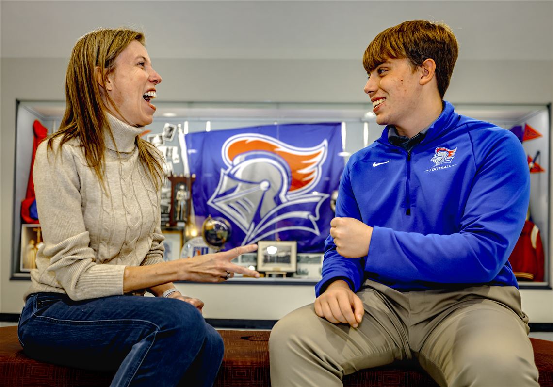 Matthew Mayle defeats his mom, Christine, in a round of the hand gesture game rock paper scissors in St. Frances de Sales on Oct. 24 in central Toledo.