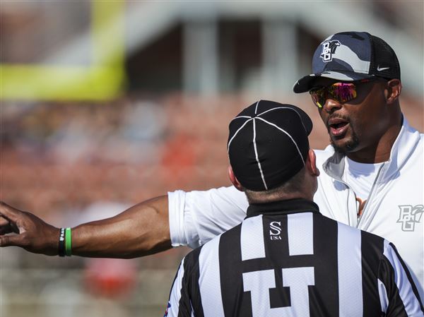 BGSU head coach Eddie George makes some finer points to the referees as the Falcons played Central Michigan in a college football game at Doyt Perry Stadium on Oct. 18  in Bowling Green. George’s team was heavily penalized in the game for both live and dead ball infractions.