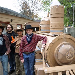 From left, Joey McCready, 17, Hudson Tremblay, 17, Kenshin Kim, 17, and Tyler McCourt, 16, with a cardboard train they made for Halloween at a residence on Bonsels Parkway in Sylvania Township on Oct. 29.
