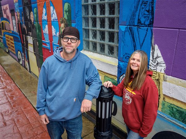 Business owners Jeremy Roehrig and Annette Miller on Oct. 30 in Defiance. They are donating gas and food cards to people in need.