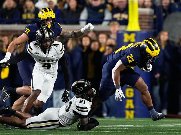 Jordan Marshall runs for 185 yards and 3 TDs to help No. 21 Michigan hold off Purdue for 21-16 win