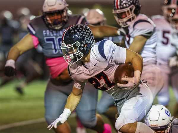 Napoleon RB Hayden Groll churns for tough yards against Fremont Ross in a high school football game at Don Paul Stadium on Oct. 17 in Fremont, Ohio.
