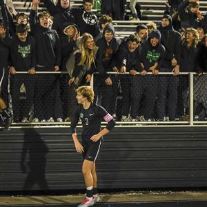 Ottawa Hills’s Maddock Robson (3) is celebrated by fans after defeating Kidron Central Christian in a Division V boys soccer state semifinal game at Firelands Health Stadium on Wednesday, Nov. 5, 2025, in Sandusky, Ohio.