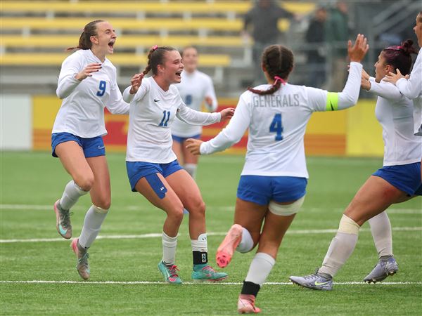 Anthony Wayne teammates Adilyn Doriot (9) and Lila Simon (11) celebrate as time expires at the state championship game against Hudson as part of the OHSAA State Soccer Tournament at Historic Crew Stadium on Nov. 7.
