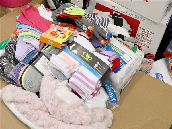 United Way shelf stocker event to create cold-weather and hygiene kits
