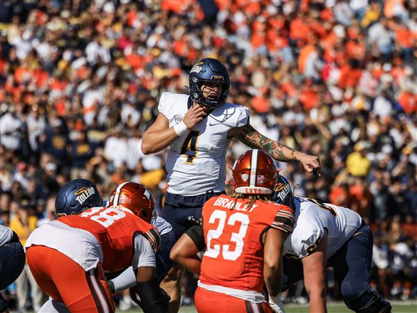 Toledo’s QB Tucker Gleason calls out a play to his teammates during the Battle of I-75 against BGSU on Oct. 11 at Doyt L. Perry Stadium in Bowling Green.
