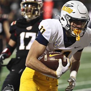 Toledo' s Ryder Treadway catches a touchdown pass during their game against Miami (Ohio) Wednesday in Oxford, Ohio.