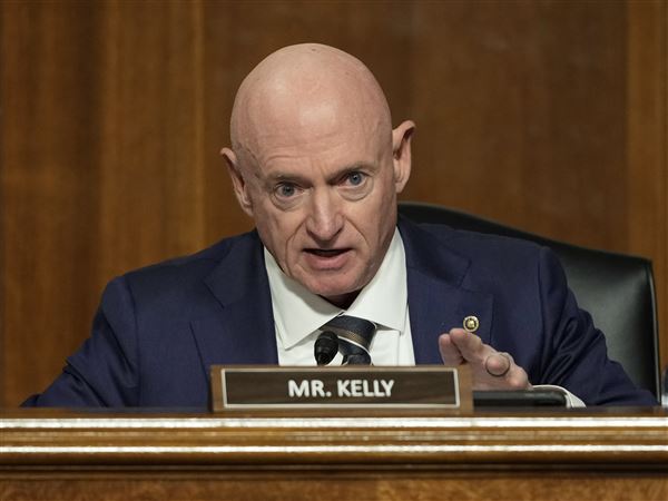 Sen. Mark Kelly, D-Ariz., speaks during the Senate Armed Services Committee confirmation hearing for Pete Hegseth on Jan. 14 in Washington.