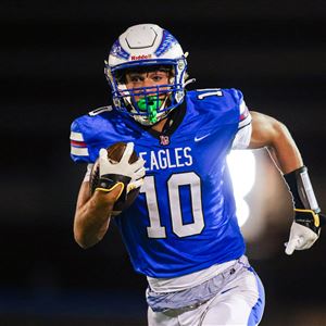 Liberty-Benton's Seth Elchert runs with the ball as the Eagles host Delta in a first round OHSAA football playoff matchup on Oct. 31 in Findlay.