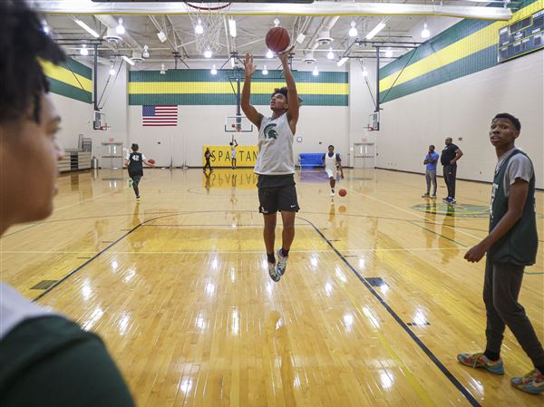 Kaden Mikolajczyk, of Start High School’s basketball team, shoots the ball during practice at Start High School in Toledo on Dec. 2.