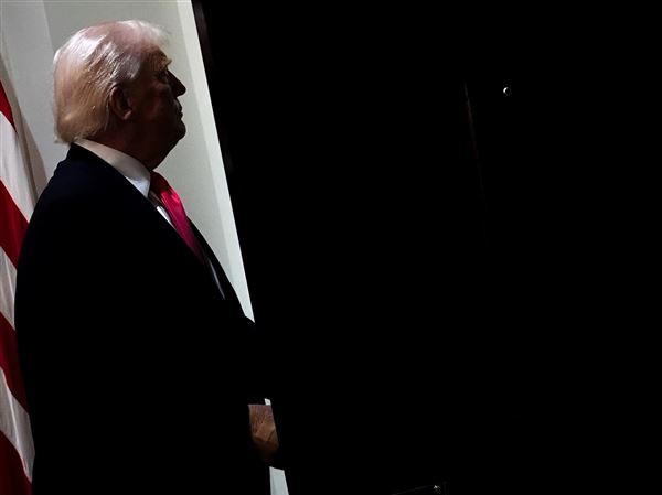 President Donald Trump walks out of the Cabinet Room following a Cabinet meeting on Dec. 2 at the White House.