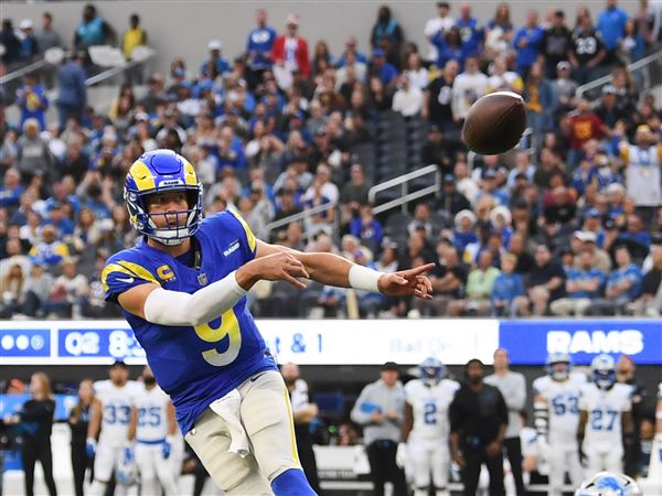 Stafford rallies Rams to 41-34 victory over Lions, clinching playoff berth